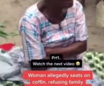 Watch|| Elderly woman sits on coffin, allegedly refuses to allow family bury corpse