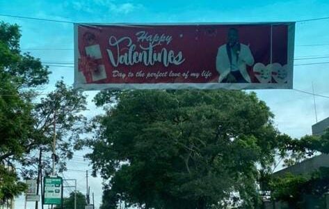 Lady mounts a banner at Immigration Offices as Valentine’s Day hit a climax in Blantyre (see Photos)