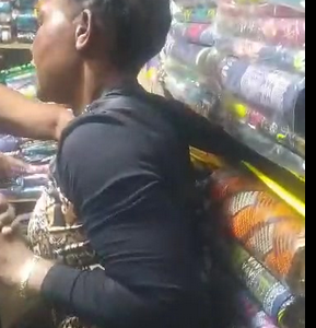Woman beaten mercilessly after being caught red-handed stealing Chitenje (watch video)